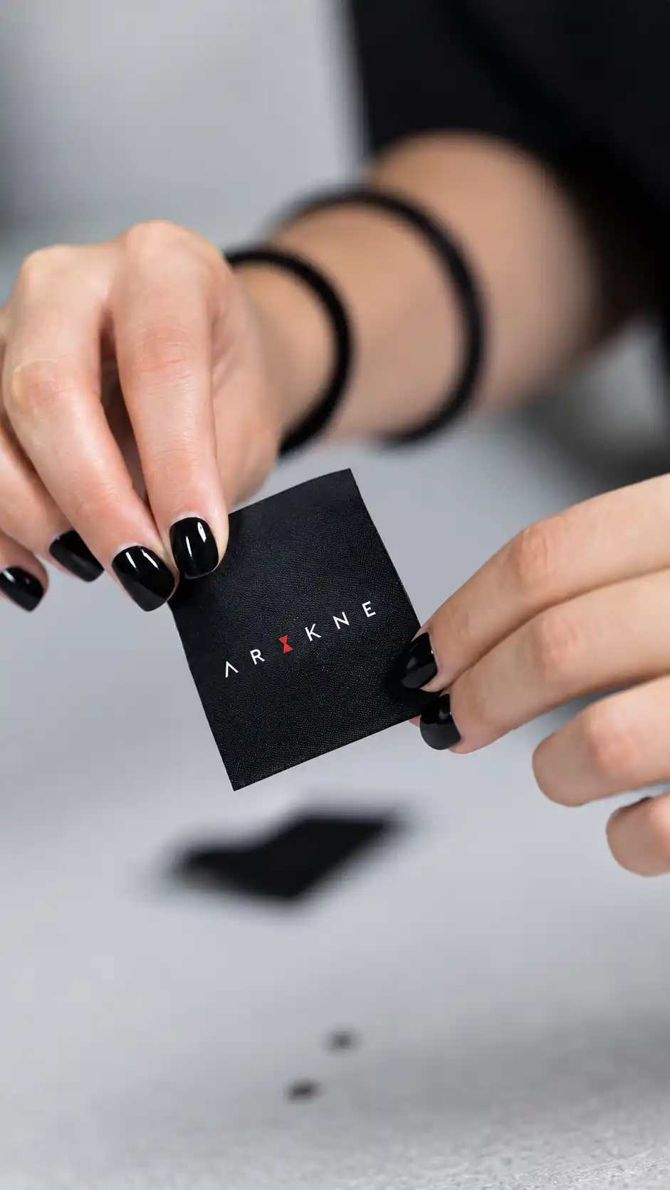 ARAKNE brand label